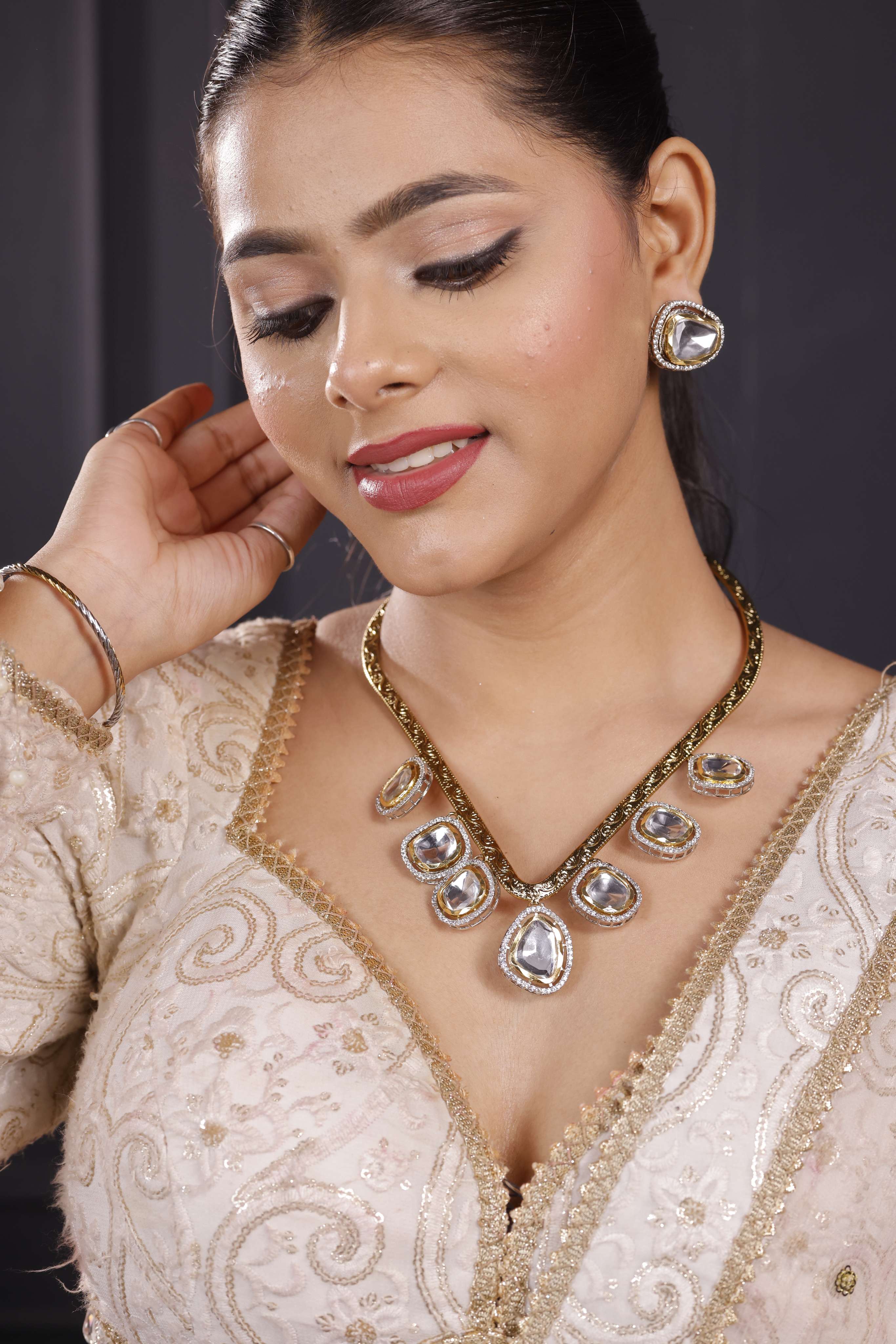 Golden dropping Hasli Set with Studs