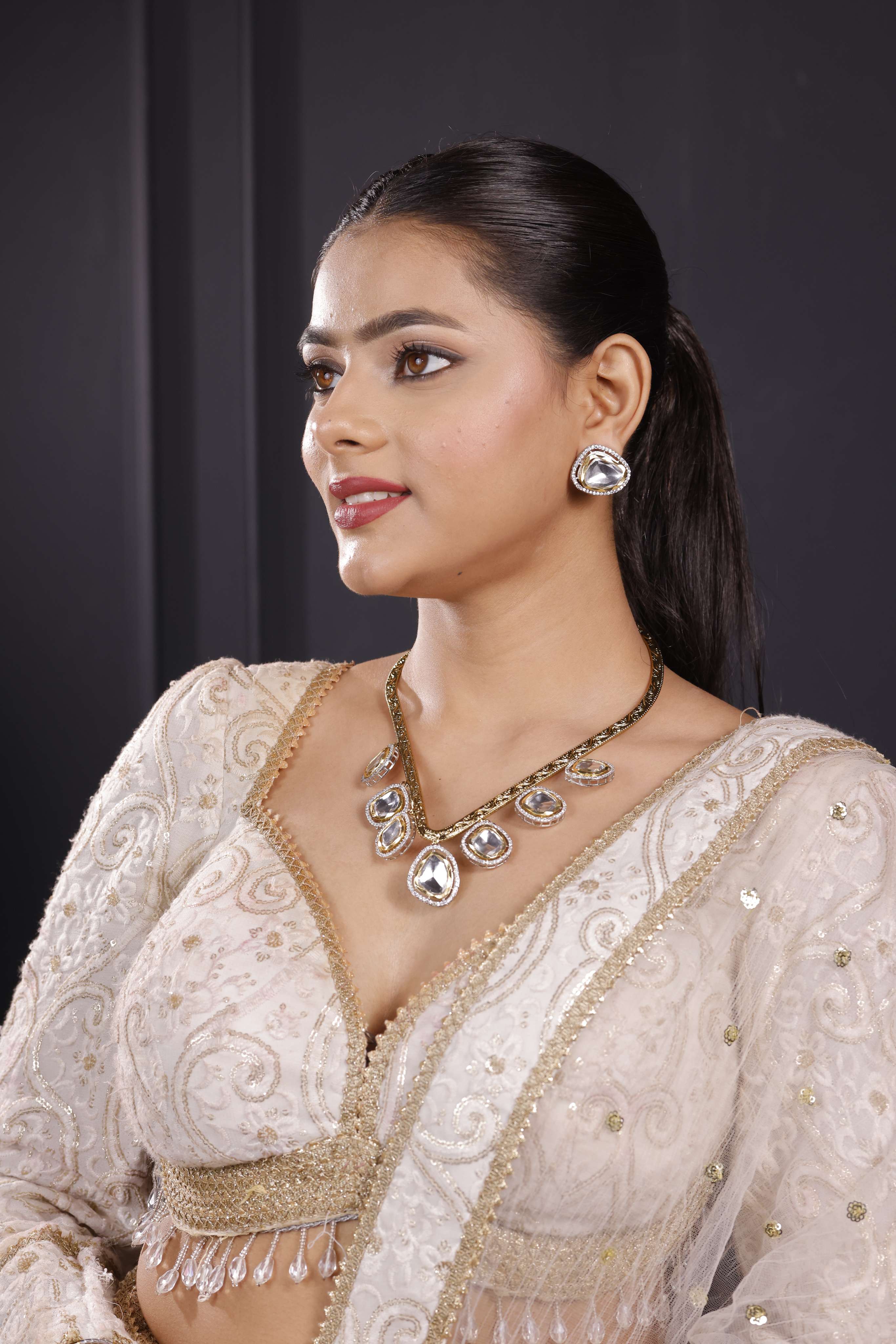 Golden dropping Hasli Set with Studs